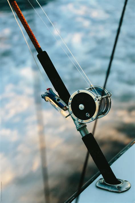 "Close Up Of Fishing Rod And Spool" by Stocksy Contributor "Luke Mattson" - Stocksy