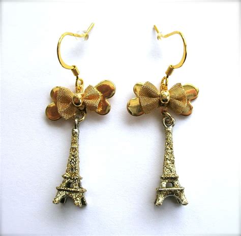 Stunning Sparkling Gold Tone Eiffel Tower Earrings with Gold Bow | Earrings, Gold tones, Gold ...