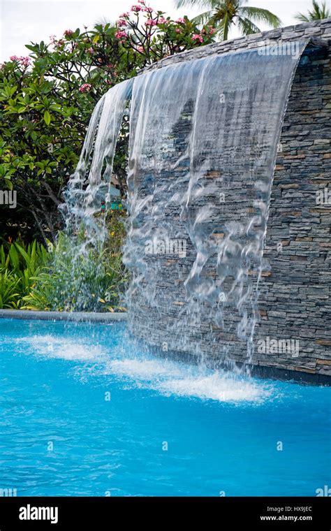 Waterfall in the swimming pool Stock Photo - Alamy