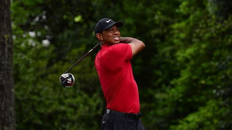 Masters champion Tiger Woods plays a stroke on the No. 2 tee box during the final round of the ...