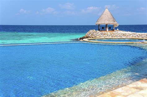 Blue Infinity Pool. Maldives Photograph by Jenny Rainbow - Fine Art America