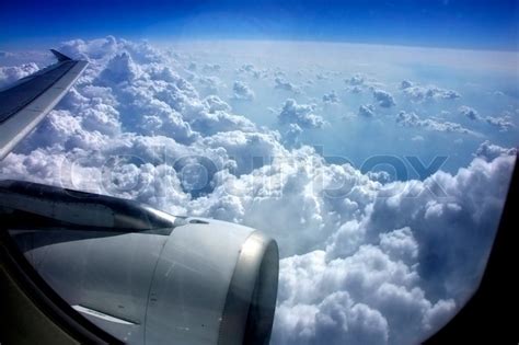 Look from windows aboard a plane on blue sky with clouds | Stock Photo ...