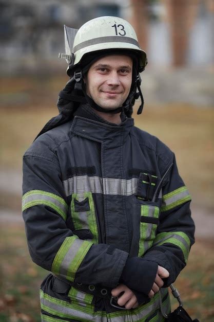 Closeup portrait of a firefighter portrait of a middleaged firefighter in uniform - Stock Image ...