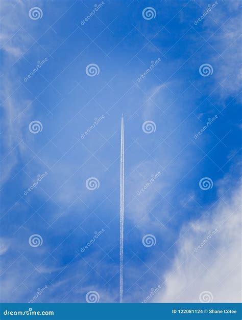 Jet in Sky with Vapor Trail Vertical Stock Photo - Image of motion, atmosphere: 122081124