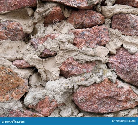 Wall of Pink Granite and Cement Mortar. Rubble Masonry. Background ...