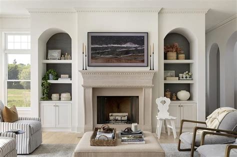 Beige Limestone Fireplace Flanked by Arched Built Ins - Transitional ...