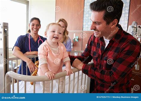 Pediatrician Visiting Parents and Child in Hospital Bed Stock Image - Image of caring, months ...