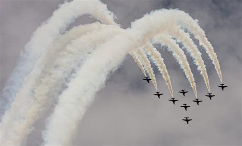 Red Arrows smoke trails during loop at RAF Cosford 2019 Photograph by ...