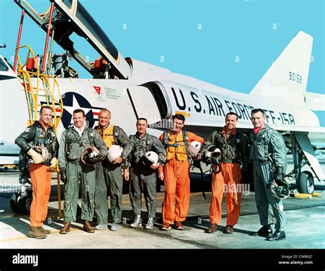 Original seven Project Mercury astronauts standing beside a Convair 106 ...