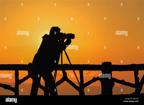 silhouette photographer with sunset Stock Photo - Alamy