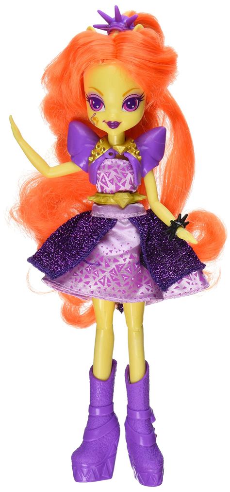 a doll with orange hair and purple dress