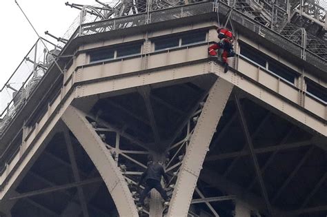 Eiffel Tower closes down after man scales the monument - CBS News