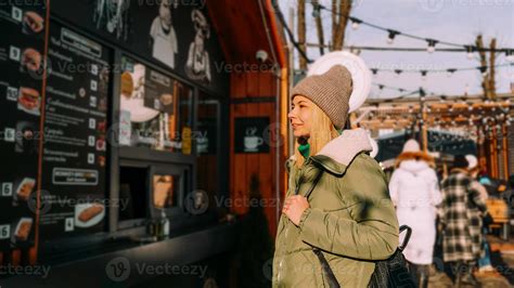 Woman at food fair chooses food from a menu 6073482 Stock Photo at Vecteezy