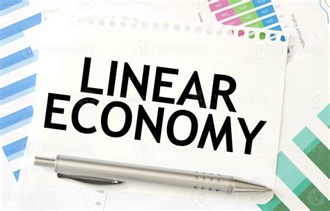 LINEAR ECONOMY on paper sheet on charts 27612951 Stock Photo at Vecteezy