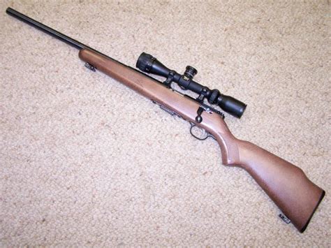 SAVAGE MODEL 93 R17 17 HMR CALBER, HEAVY BBL, LH ACTION, 3x9 SCOPE