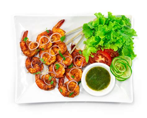 Premium Photo | Tandoori Shrimps Grilled Skewers served Mint Sauce is a ...