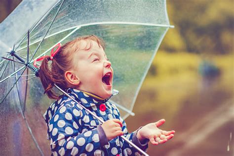 Happy In Rain Stock Photo - Download Image Now - Child, Rain, Umbrella ...