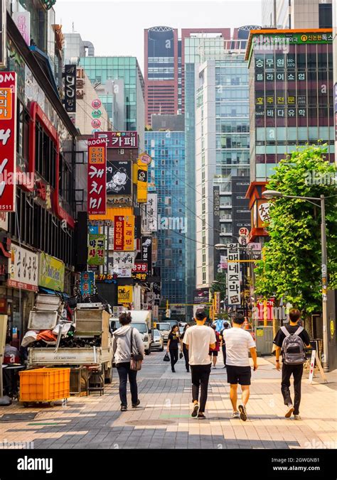 Seoul, South Korea - June 16, 2017: People walking down a small street ...