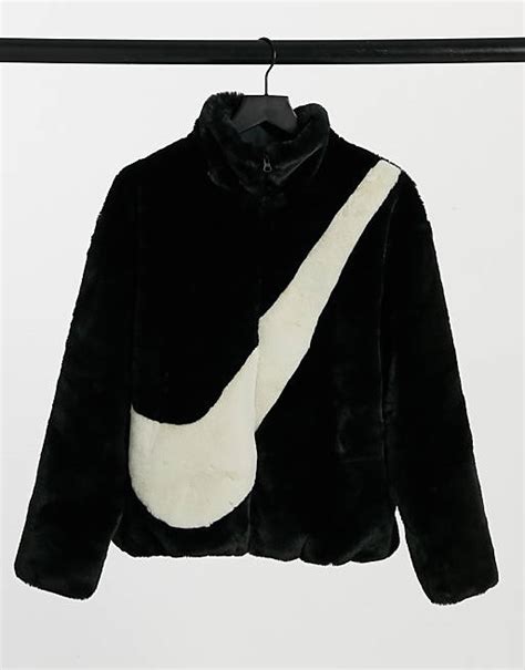 Nike faux fur oversized swoosh jacket in black | ASOS