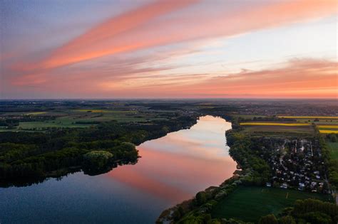 Aerial View of Lake During Golden Hour · Free Stock Photo