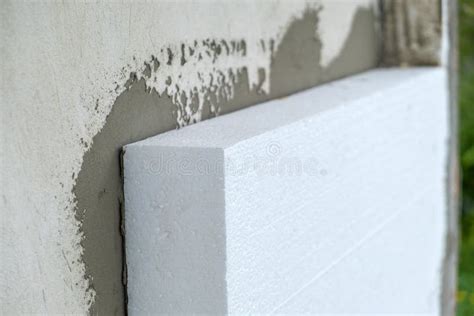 Installation of Styrofoam Insulation Sheets on House Facade Wall for ...