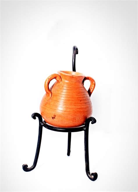 www.arabisque.org Clay pot mounted on a metal stand. 30 LE code A106 | Clay pots, Egyptian