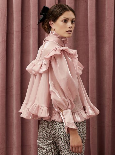 Ruffle bow blouse in a shimmery fabric. A high Victorian neckline and stand up ruffle collar ...