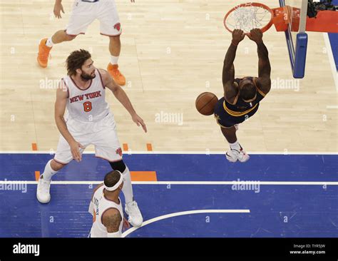 New York Knicks Carmelo Anthony and Robin Lopez watch Cleveland ...