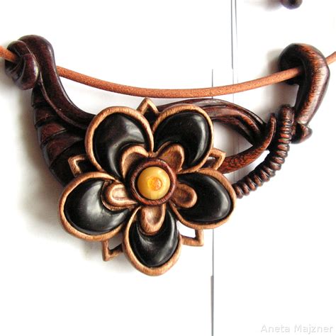Flower - hand carved necklace by AmberSculpture on DeviantArt