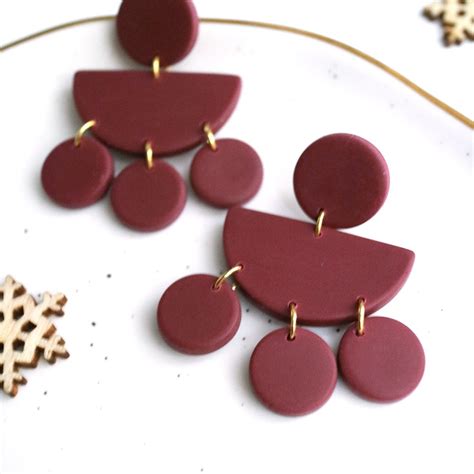 Handmade Burgundy Cute Circle Dangle Earrings By By Coya | Diy clay earrings, Clay earrings ...