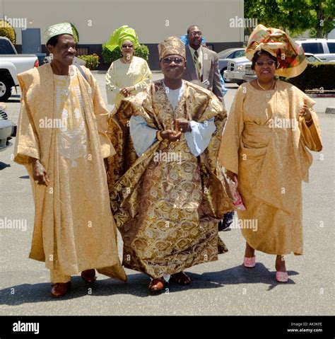 Dressed in the ceremonial robes of the Yoruba Tribe of Nigeria guests ...