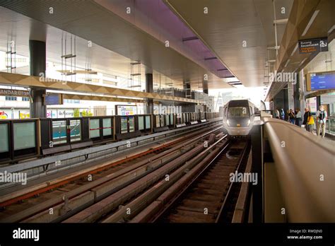 Kuala Lumpur, Malaysia, MRT, LRT monorail light railway train arriving at platform Stock Photo ...