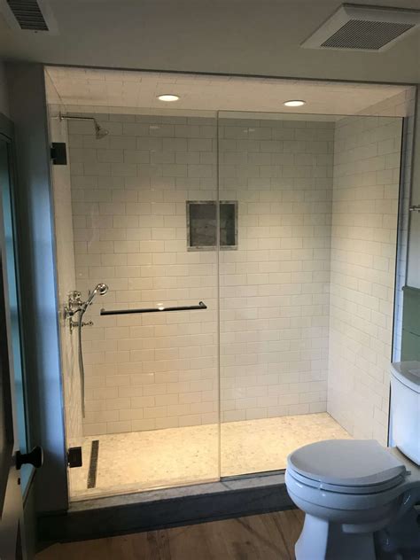 Frameless Shower Door and Panel with Towel Bar by Absolute Shower Doors