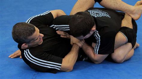 How to Do a Triangle Choke from Guard Using Overhook - Howcast