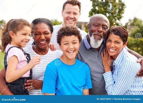 Portrait of Smiling Multi-Generation Mixed Race Family in Garden at Home Stock Image - Image of ...