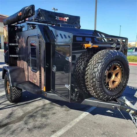 an off road utility vehicle parked in a parking lot