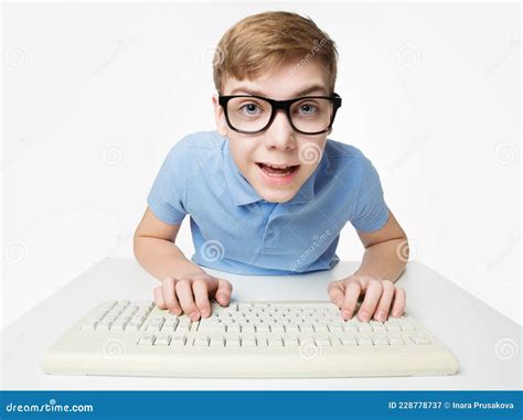 Surprised Child Using Computer Keyboard. Teenage Boy Hacker Typing on ...