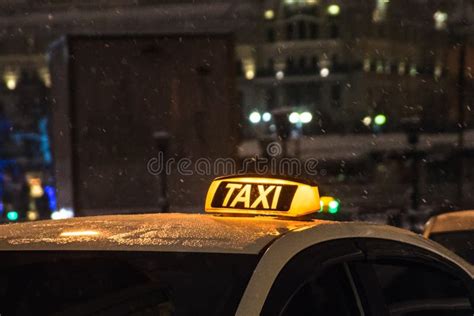 Illuminated Taxi Sign on the Roof of a Taxi at Night City Stock Image - Image of downtown ...