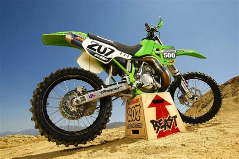 Green KX 500 Dirt Bike on Sandy Hill