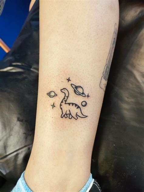 Space Dinosaur Tattoo | Dinosaur tattoos, Planet tattoos, Sleeve tattoos