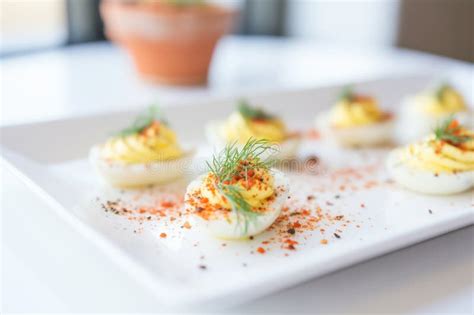 Deviled Eggs on a White Platter with Paprika Sprinkles Stock Photo ...