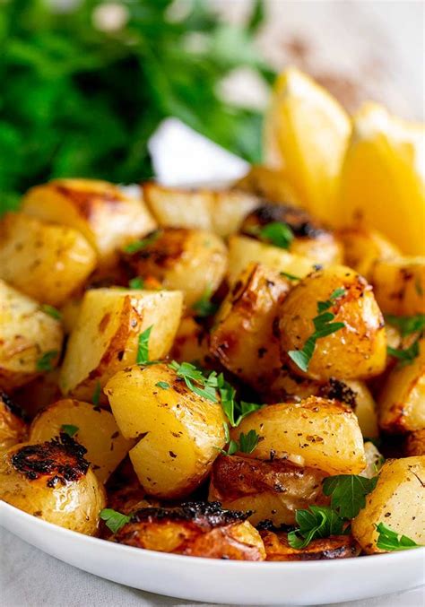 These authentic slow roasted Greek lemon potatoes are packed with delicious fresh zesty flavors ...