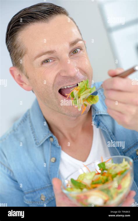 man eating salad Stock Photo - Alamy