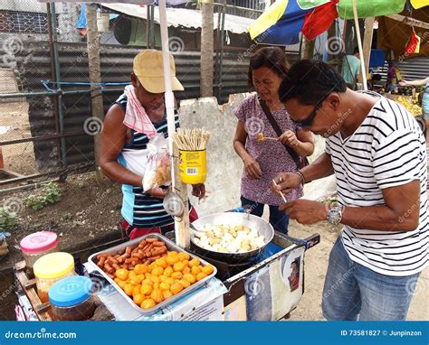 A Food Vendor Cooks Fish Balls, Sausages and Quail Eggs Which he Sells on a Food Cart Editorial ...