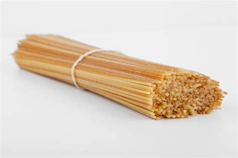 Uncooked Spaghetti in a Bundle Stock Image - Image of uncooked, yellow: 21684577