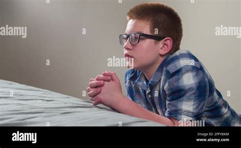 Boy praying bed Stock Videos & Footage - HD and 4K Video Clips - Alamy