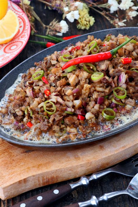 Authentic Kapampangan Sisig recipe using pork belly - Foxy Folksy