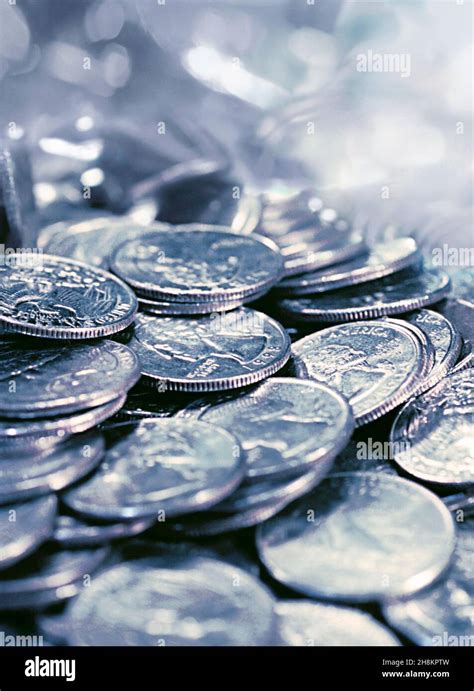 Silver coins. Pile of silver coins.Saving money. American quarters in a ...