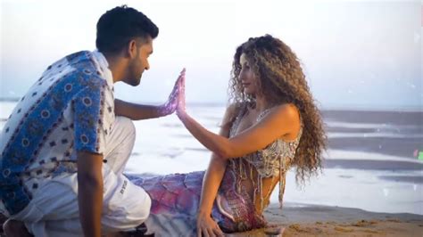 Trending: Nora Fatehi gets cosy with Guru Randhawa on the beach, all ...