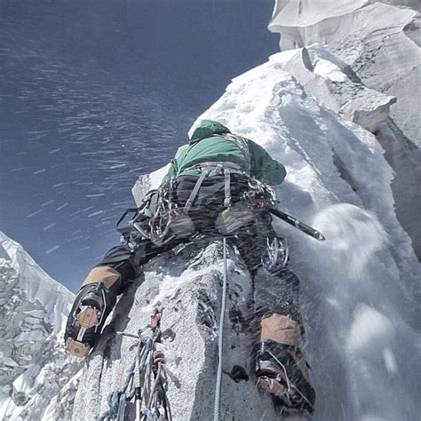 Pictured above @jimmy_chin riding the 'shark fin' of the #meru summit ...